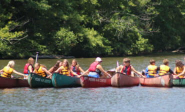 line-of-kayaks-e1573842223465.jpg