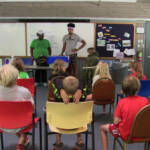 Classroom with students seated, learning about the Beaver Pond